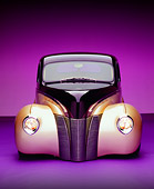 AUT 26 RK0549 06
1940 Ford Deluxe Opera Coupe Purple And Champagne Head On Shot On Purple Studio