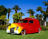 AUT 26 RK0578 05
1940 Mercury Delivery Sedan Red With Flames 3/4 Front View On Grass By Palm Trees