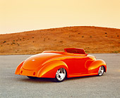 AUT 26 RK0590 04
1939 Ford Deluxe Convertible Orange 3/4 Rear View On Pavement By Dry Grass Hills