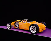 AUT 26 RK0655 06
1926 Ford Dore Roadster Orange 3/4 Rear View On Purple Floor Studio