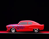 AUT 26 RK0658 03
1952 Kaiser Frazer Henry J Coupe Red With Flames Profile View On Red Floor Gray Line Studio