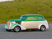 AUT 26 RK0668 01
1937 Chevrolet Sedan Green And White 3/4 Side View On Pavement By Grass Hill