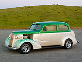AUT 26 RK0669 01
1937 Chevrolet Sedan Green And White 3/4 Side View On Pavement By Grass Hill