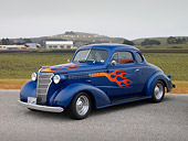 AUT 26 RK1152 01
1938 Chevrolet Master Deluxe Coupe Blue 3/4 Side View On Pavement