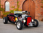 AUT 26 RK1201 01
1929 Ford Roadster Hot Rod Black With Flames Front 3/4 View On Pavement By Building Door