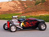 AUT 26 RK1203 01
1929 Ford Roadster Hot Rod Black With Flames Front 3/4 View On Pavement By Field Hills