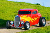 AUT 26 RK1224 01
1934 Ford 3-Window Coupe With Flames 3/4 Front View On Dirt By Grass Hill