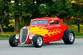 AUT 26 RK1226 01
1934 Ford 3-Window Coupe With Flames 3/4 Front View On Pavement By Trees