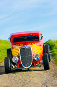 AUT 26 RK1228 01
1934 Ford 3-Window Coupe With Flames Head On View On Dirt By Grass Hill