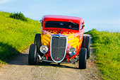 AUT 26 RK1229 01
1934 Ford 3-Window Coupe With Flames Head On View On Dirt By Grass Hill