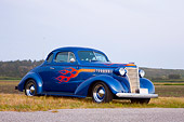 AUT 26 RK1290 01
1938 Chevrolet Coupe Hot Rod Blue 3/4 Front View In Field