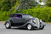 AUT 26 RK1297 01
1934 Chevrolet Phaeton Hot Rod Black 3/4 Front View By Trees Shrubs
