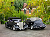 AUT 26 RK1298 01
Two 1934 Chevrolet Phaeton Hot Rods Black 3/4 Front & Rear Views By Trees Shrubs