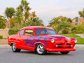 AUT 26 RK2657 01
1952 Kaiser Frazer Henry J Coupe Red With Flames 3/4 Front View On Pavement By Palm Trees