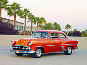 AUT 26 RK2670 01
1953 Chevrolet 210 Coupe Hot Rod Orange With Flames 3/4 Front View On Pavement By Palm Trees
