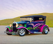AUT 26 RK2702 01
1931 Ford Model A Deluxe Phaeton Hot Rod Purple Green And Pink Flames 3/4 Front View On Pavement By Hills