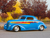 AUT 26 RK2733 01
1938 Chevrolet Coupe Hot Rod Blue 3/4 Front View On Pavement By Trees