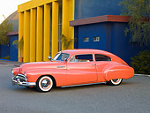 AUT 26 RK2743 01
1948 Buick Super Hot Rod Salmon 3/4 Front View On Pavement By Building