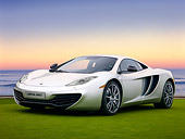 AUT 28 RK0126 01
2012 McLaren MP4-12C Prototype Silver 3/4 Front View On Grass By Building