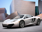 AUT 28 RK0131 01
2012 McLaren MP4-12C Prototype Silver 3/4 Front View On Grass By Building
