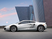 AUT 28 RK0141 01
2012 McLaren MP4-12C Prototype Silver Profile View On Grass By Building
