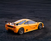 AUT 28 RK0012 04
1996 McLaren F1 LM Orange Overhead 3/4 Rear View On Coal Field