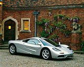 AUT 28 RK0029 02
McLaren F-1 Silver 3/4 Front View On Stone Pavement By Brick House
