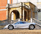 AUT 28 RK0067 05
McLaren F1 Silver 3/4 Front View On Gravel By Building And Steps