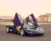 AUT 28 RK0114 01
1993 McLaren F1 XP4 Blue 3/4 Front View Doors Open On Pavement