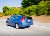 AUT 29 BK0003 01
2010 Honda Insight Blue 3/4 Rear View Driving On Road