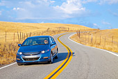 AUT 29 BK0009 01
2010 Honda Insight Blue 3/4 Front View Driving On Road