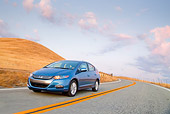 AUT 29 BK0011 01
2010 Honda Insight Blue 3/4 Front View Driving On Road
