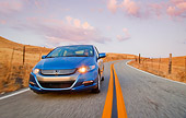 AUT 29 BK0012 01
2010 Honda Insight Blue 3/4 Front View Driving On Road
