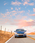AUT 29 BK0014 01
2010 Honda Insight Blue Front View Driving On Road