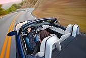 AUT 29 BK0015 01
2009 BMW Z4 Convertible Blue Driving On Road Overhead View