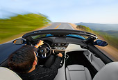 AUT 29 BK0020 01
2009 BMW Z4 Convertible Blue Driving On Road Overhead View
