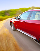 AUT 29 BK0025 01
2010 BMW X6 Sports Activity Vehicle Red Driving On Road