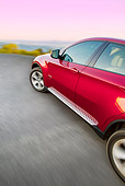 AUT 29 BK0026 01
2010 BMW X6 Sports Activity Vehicle Red Driving On Road