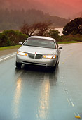 AUT 29 RK0090 26
1998 Lincoln Town Car Silver 3/4 Front View On Road In Motion