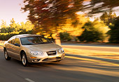 AUT 29 RK0146 01
1999 Chrysler 300M Champagne 3/4 Front View On Road In Motion