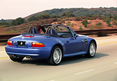 AUT 29 RK0161 04
1999 BMW M Roadster Z3 Convertible Blue 3/4 Rear View On Road In Motion