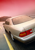 AUT 29 RK0256 01
1999 Lexus LS400 Champagne 3/4 Rear View On Road In Motion