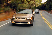 AUT 29 RK0446 01
1999 Pontiac Grand Am Gold Head On View On Road In Motion