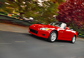 AUT 29 RK0465 01
2000 Honda S2000 Convertible Red Low 3/4 Front View On Road In Motion