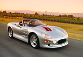 AUT 29 RK0567 23
1999 Shelby Series 1 Convertible Silver 3/4 Front View On Road In Motion Filtered