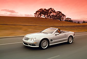 AUT 29 RK0630 04
2003 Mercedes-Benz SL55 AMG Roadster Silver 3/4 Front View On Road In Motion Filtered