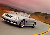 AUT 29 RK0630 20
2003 Mercedes-Benz SL55 AMG Roadster Silver 3/4 Front View On Road In Motion Filtered