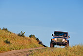 AUT 29 RK0701 02
2004 Jeep Wrangler Rubicon Light Khaki Head On Shot On Dirt Hill