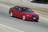 AUT 29 RK0805 01
2004 BMW 330i 3 Series Red Side 3/4 View On Road In Motion
