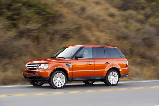 AUT 29 RK0859 01 2006 Range Rover Sport Supercharged Orange 3 4 Side View